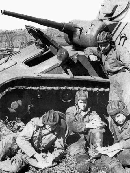 Tank crew sleep near their T-70