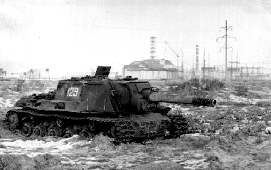 An abandoned ISU-152 with the Chernobyl nuclear facility in the background. This tank is far too irradiated for further use.