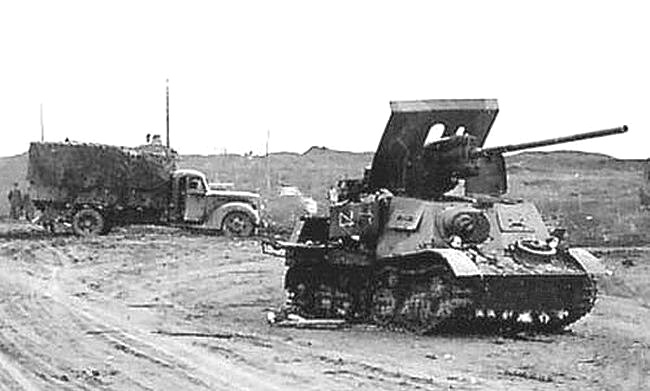 Another knocked out ZiS-30 as part of a column.