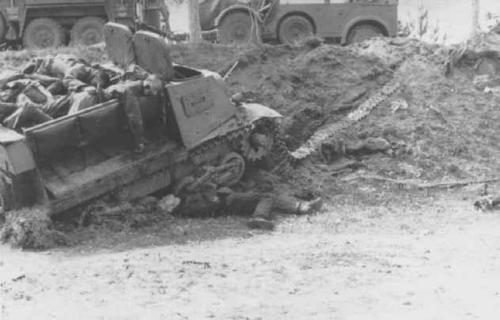 A knocked out Komsomolets used as an APC. The passengers lie dead on top and beneath it.