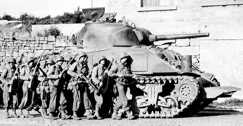 M4 in Belgium, advancing in close support of a US platoon, 1944