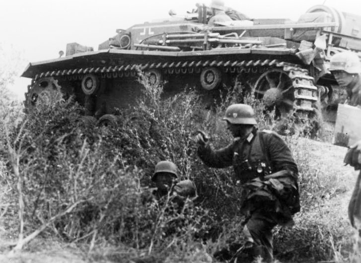 StuG III attacking with infantry